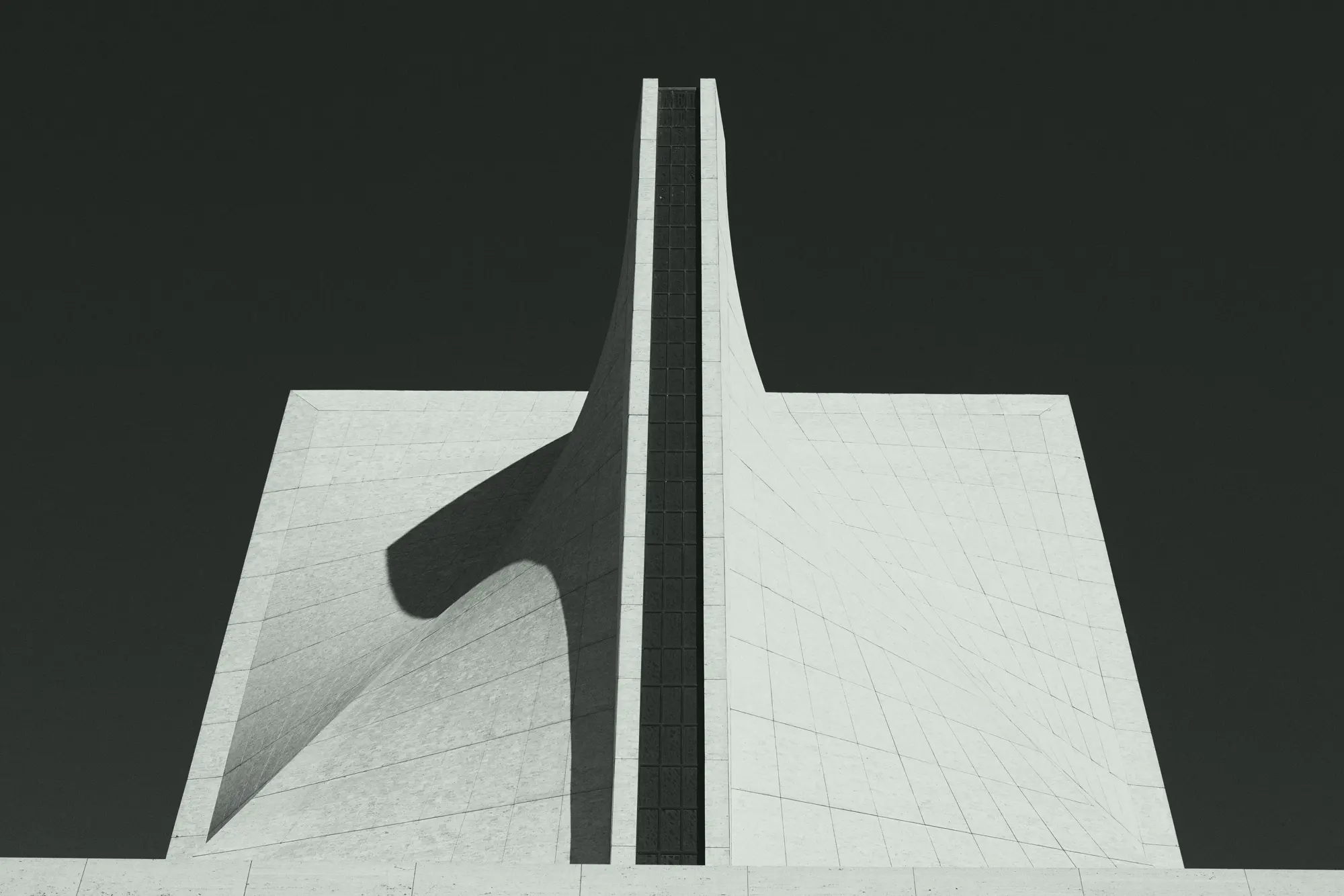 A white concrete building with a single sweeping fin against a dark sky